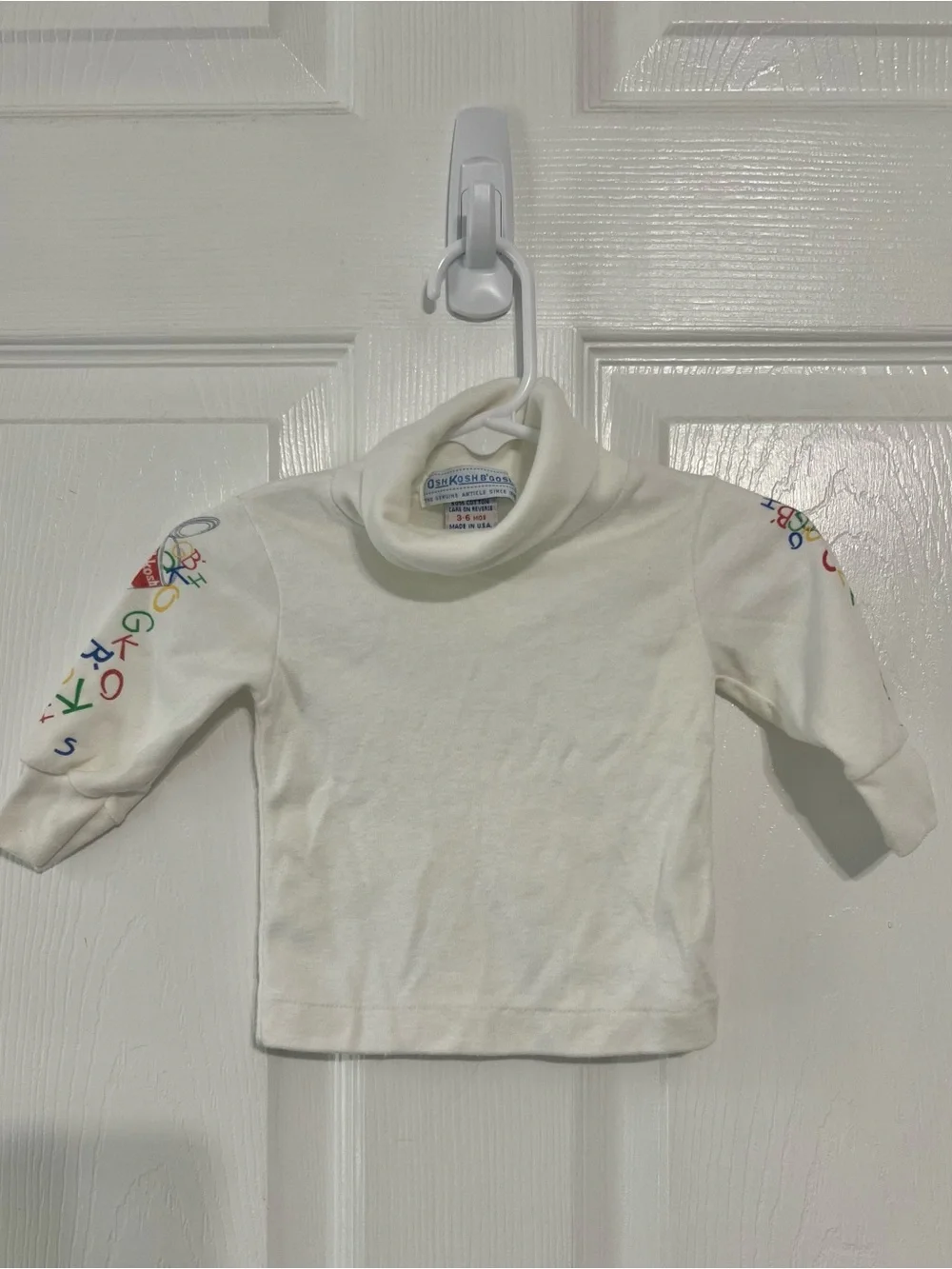 Vintage 80’s OshKosh B'gosh Cream Turtleneck with Multicolor Sleeve Letters